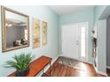 Inviting entryway with a stylish mirror, decorative art, and a functional bench, setting a welcoming tone at 426 Mountain Laurel Cir, Goose Creek, SC 29445