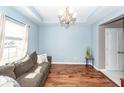 Comfortable living room featuring hardwood floors, soft lighting, and a cozy couch, perfect for relaxation at 426 Mountain Laurel Cir, Goose Creek, SC 29445