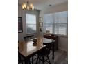 Inviting dining area with natural light, charming decor, and room for entertaining guests at 618 Hilchot Dr, Summerville, SC 29486