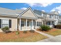 Charming single-story home featuring neutral siding, a covered porch, and well-maintained landscaping at 113 Broad River Dr, Summerville, SC 29485