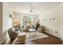 Bright living room with large windows, comfortable seating, and stylish decor at 1622 Telfair Way, Charleston, SC 29412