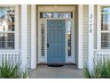 Welcoming front entrance featuring a stylish blue door with sidelights and decorative trim at 2176 Andover Way, Mount Pleasant, SC 29466