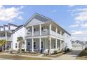 Beautiful two-story home featuring a spacious double porch, set in a well-maintained neighborhood at 225 Bird Song Path, Summerville, SC 29485