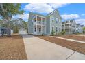 Beautiful two-story house featuring a double front porch and long driveway at 2270 Kemmerlin St, Johns Island, SC 29455