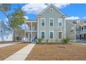 Lovely two-story home with double porches and well-maintained landscaping at 2270 Kemmerlin St, Johns Island, SC 29455