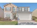 Inviting two-story home with a spacious two-car garage and a welcoming entrance at 232 Decatur Dr, Summerville, SC 29486