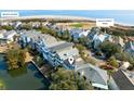 Aerial view of the neighborhood, highlighting the home's proximity to the beach, pool, and Intracoastal Waterway at 27 Ocean Point Dr, Isle of Palms, SC 29451