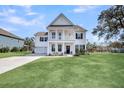 Charming two-story home with a well-manicured lawn and inviting curb appeal at 3213 Great Egret Dr, Johns Island, SC 29455
