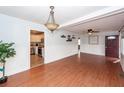 Bright living room with hardwood floors, ceiling fan, and view into the modern kitchen at 340 Annette Dr, Goose Creek, SC 29445