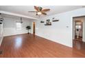 Spacious living room featuring hardwood floors, wainscoting, and a view to the bathroom at 340 Annette Dr, Goose Creek, SC 29445