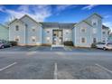 Inviting blue two-story condo with ample parking spaces in front and a well maintained exterior at 6275 Rolling Fork Rd # C, North Charleston, SC 29406