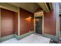 Covered entrance featuring a modern door, and exterior light fixture at 8409 Hidden Bakers Trce, North Charleston, SC 29418