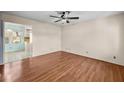 Bright living room with wood floors, a ceiling fan, and view to kitchen at 100 Pine Ridge Dr, Goose Creek, SC 29445