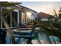 Backyard showcasing a pool, spa, and outdoor seating area, perfect for relaxation and entertaining at 108 Whaler Ave, Summerville, SC 29486