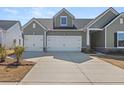 Charming two-story home with a three-car garage and well-manicured lawn at 1107 Bellwether Ln, Summerville, SC 29485