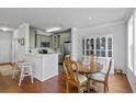 Charming eat-in kitchen features modern appliances, a wooden table, and a cozy ambiance at 130 River Landing Dr # 4209, Charleston, SC 29492