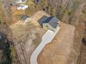 Aerial view of the property showcasing the home's placement on a spacious lot with long drive way and shed at 1738 N N Hwy 52, Bonneau, SC 29431