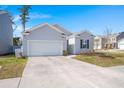 Well-maintained single-Gathering home featuring a spacious front lawn and an attached two-car garage at 202 Tall Grass Ct, Summerville, SC 29483