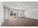 Spacious room featuring vinyl wood flooring and sliding glass doors for natural light at 204 Cozy Brook Ct, Summerville, SC 29486