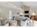Inviting living room boasts natural light, stylish furnishings, and a cozy fireplace for comfortable living at 2276 Seascape Ct, Seabrook Island, SC 29455