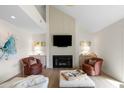 Charming living room with a cozy fireplace, comfortable armchairs, and tasteful decor for a warm ambiance at 2276 Seascape Ct, Seabrook Island, SC 29455