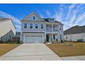 Charming two-story home with a two car garage, beautiful balcony and inviting curb appeal at 2905 Cavalcade Cir, Johns Island, SC 29455