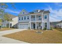 Charming two-story home with a two car garage, beautiful balcony and inviting curb appeal at 2905 Cavalcade Cir, Johns Island, SC 29455