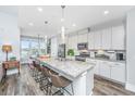 Bright kitchen features a large island with seating and modern white cabinetry at 292 Lotz Dr, Summerville, SC 29483