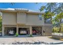 Spacious ground-level garage with parking for multiple vehicles and golf cart, ideal for storage at 308 Jungle Rd, Edisto Beach, SC 29438