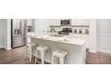 Modern kitchen boasts stainless steel appliances, granite countertops, and a convenient center island at 317 Pine Crest View, Summerville, SC 29486