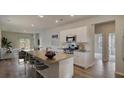 Modern kitchen featuring stainless steel appliances, a granite island with seating, and ample cabinet space at 319 Pine Crest View, Summerville, SC 29486