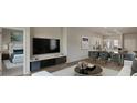 Spacious open-concept living room with modern furnishings seamlessly connected to the dining area and kitchen at 319 Pine Crest View, Summerville, SC 29486