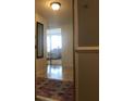 A view of unit 4C entry way showing the living room area and tile flooring at 330 Concord St # 4C, Charleston, SC 29401