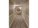 Hallway with neutral carpet and wall colors and contemporary decorations at 330 Concord St # 4C, Charleston, SC 29401