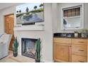 Cozy living room with a fireplace, bar area and ample natural light at 409 Yacht Harbor Ct # 409, Isle of Palms, SC 29451