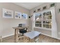 Bright office with wood flooring, natural light, and functional furniture at 5073 Blair Rd, Summerville, SC 29483