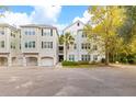 The exterior of the condominium shows garages and easy access to stairs and an elevator at 60 Fenwick Hall Allee # 521, Johns Island, SC 29455