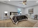Bright bedroom featuring neutral tones, a ceiling fan, and a cozy rug at 828 Longbranch Dr, Charleston, SC 29414