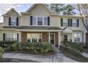 Attractive townhome exterior with brick accents, green shrubbery, and manicured front yard at 901 Elm Hall Cir, Summerville, SC 29483