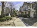 Inviting exterior elevation with a well-maintained lawn and view of the community pond and fountain at 901 Elm Hall Cir, Summerville, SC 29483