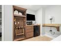 Bedroom with a closet space and other amenities including a TV, microwave, and mini fridge at 1004 Ocean Boulevard # 110, Isle of Palms, SC 29451