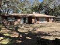 Classic red brick home with mature trees and a large yard at 111 Newington Rd, Summerville, SC 29485