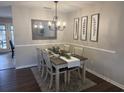Well-decorated dining area with a chandelier, feather artwork, and a dining table with seating for four at 120 Hornby Cir, Goose Creek, SC 29445