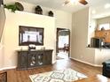 Comfortable living room featuring hardwood floors and an open layout to dining and kitchen at 1346 Ashley Gardens Blvd, Charleston, SC 29414