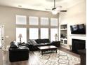 Spacious living room with high ceilings, fireplace and large windows filling the space with light at 1346 Ashley Gardens Blvd, Charleston, SC 29414