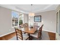 Elegant dining room with natural light, tray ceiling, and wood furnishings at 2124 Tall Grass Cir, Mount Pleasant, SC 29466