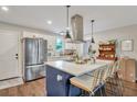 Modern kitchen features a center island, stainless appliances, and stylish pendant lighting at 2420 Cherokee Hall Ln, Charleston, SC 29414