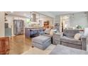 Cozy living room open to a kitchen with a stainless steel refrigerator at 2420 Cherokee Hall Ln, Charleston, SC 29414