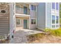 Inviting condo entrance with well-lit entryways and a neatly maintained walkway at 274 Alexandra Dr # 14, Mount Pleasant, SC 29464