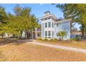 Stylish condo building with modern architecture, balconies, and lush landscaping at 274 Alexandra Dr # 14, Mount Pleasant, SC 29464